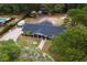 Birds-eye view of a home with sprawling yard and tree coverage, close to neighborhood amenities and entertainment at 39812 French Rd, Lady Lake, FL 32159