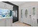 Bright foyer featuring neutral tile flooring, built-in aquarium, and stylish front door with decorative glass at 39812 French Rd, Lady Lake, FL 32159