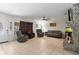 Bright living room with neutral tile, comfortable seating, and a unique fireplace feature, creating a cozy atmosphere at 39812 French Rd, Lady Lake, FL 32159