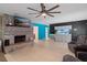 Inviting living room with a fireplace, aquarium, and cozy seating, perfect for relaxing and entertaining guests at 39812 French Rd, Lady Lake, FL 32159