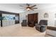 Open-concept living area featuring tile floors, neutral walls, aquarium and ample space for comfortable living at 39812 French Rd, Lady Lake, FL 32159
