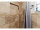 Shower stall featuring decorative tilework and a built-in niche, offering style and convenience at 39812 French Rd, Lady Lake, FL 32159