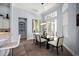 Bright dining area featuring elegant decor, a modern light fixture and access to the backyard at 4033 Swaying Palm Ct, The Villages, FL 32163