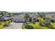 Stunning single-story home with mature palm trees and lush green grass creating great curb appeal at 4033 Swaying Palm Ct, The Villages, FL 32163