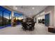 Large lanai with ample seating, ceiling fans, and access to the pool area creates the perfect entertaining space at 4033 Swaying Palm Ct, The Villages, FL 32163