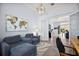 Bright living room featuring high ceilings, modern lighting, and comfortable seating at 4033 Swaying Palm Ct, The Villages, FL 32163