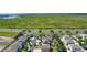 Scenic aerial view of a neighborhood with spacious homes and lush greenery near a highway at 422 Rock Springs Cir, Groveland, FL 34736