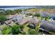 Beautiful aerial view of homes in a neighborhood and a stunning lake at 422 Rock Springs Cir, Groveland, FL 34736