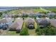 Aerial shot of a residential area showcasing well-maintained lawns and landscaping at 422 Rock Springs Cir, Groveland, FL 34736