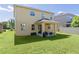 Expansive backyard featuring a covered patio perfect for outdoor entertaining at 422 Rock Springs Cir, Groveland, FL 34736