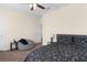 This bedroom features a cozy beanbag chair, ceiling fan and coordinated bedding, offering a relaxing retreat at 422 Rock Springs Cir, Groveland, FL 34736