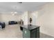 Kitchen island providing additional counter space and a gathering spot while connecting the kitchen and living room at 422 Rock Springs Cir, Groveland, FL 34736