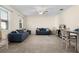 Comfortable living room with tile floors, ceiling fan, neutral walls, offering a relaxing space for entertaining or relaxing at 422 Rock Springs Cir, Groveland, FL 34736
