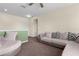 The living room has neutral walls with a sectional sofa and matching arm chair perfect for relaxing at 422 Rock Springs Cir, Groveland, FL 34736