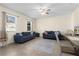 Bright and spacious living room with tile flooring, neutral walls, windows, and comfortable furniture creating a cozy atmosphere at 422 Rock Springs Cir, Groveland, FL 34736