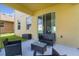Relaxing covered patio with comfortable seating offers a perfect spot to unwind and enjoy the backyard view at 422 Rock Springs Cir, Groveland, FL 34736