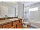 Bathroom featuring a single sink vanity and tub with white tile at 4314 Arlington Ridge Blvd, Leesburg, FL 34748