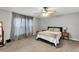 Comfortable bedroom with neutral tones, a ceiling fan, and soft carpet flooring at 4314 Arlington Ridge Blvd, Leesburg, FL 34748