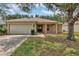Charming single-story home with a well-maintained lawn, a two-car garage and inviting front porch at 4314 Arlington Ridge Blvd, Leesburg, FL 34748