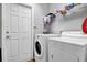 Laundry room featuring a washer and dryer at 4314 Arlington Ridge Blvd, Leesburg, FL 34748