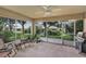 Screened patio with furniture and ceiling fan at 4314 Arlington Ridge Blvd, Leesburg, FL 34748