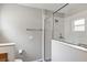 Bathroom featuring a spacious glass door shower and white tile at 4314 Arlington Ridge Blvd, Leesburg, FL 34748