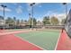 Outdoor tennis courts with nets, fencing, and lighting at 4314 Arlington Ridge Blvd, Leesburg, FL 34748