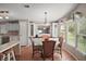 Open dining room with seating for four and lots of natural light at 5300 Tigers Tail, Leesburg, FL 34748