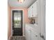 Entryway area with storage cabinets at 5300 Tigers Tail, Leesburg, FL 34748