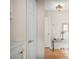 Hallway with overhead lighting, and decorative side table at 5300 Tigers Tail, Leesburg, FL 34748