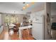 Open kitchen with breakfast bar seamlessly flows into the dining area at 5300 Tigers Tail, Leesburg, FL 34748