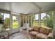 Relaxing lanai with comfortable seating and peaceful outdoor views at 5300 Tigers Tail, Leesburg, FL 34748