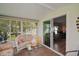 Cozy lanai with tile flooring and sliding glass door to living area at 5300 Tigers Tail, Leesburg, FL 34748