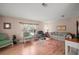 Inviting living room features lots of natural light, hardwood floors, and modern decor at 5300 Tigers Tail, Leesburg, FL 34748