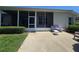Back patio area with an enclosed outdoor space and seating for relaxing at 5300 Treasure View Way, Leesburg, FL 34748