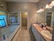 Spacious bathroom featuring a soaking tub, double vanity, and separate shower at 5300 Treasure View Way, Leesburg, FL 34748
