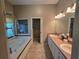 Primary bathroom suite showcasing double sinks and soaking tub at 5300 Treasure View Way, Leesburg, FL 34748