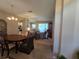 Spacious dining room with views of the living area and kitchen beyond at 5300 Treasure View Way, Leesburg, FL 34748