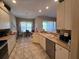 This kitchen showcases bright, neutral cabinets and countertops, offering space for cooking and casual dining at 5300 Treasure View Way, Leesburg, FL 34748