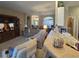 Bright living room features open layout and seamless access to kitchen area at 5300 Treasure View Way, Leesburg, FL 34748