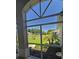 View from covered porch of well-maintained landscaping and green lawn at 5300 Treasure View Way, Leesburg, FL 34748