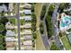 Aerial view showcasing the community, pool, and landscaping surrounding the home at 5324 Treasure View Way, Leesburg, FL 34748