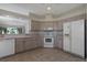 Well-equipped kitchen with updated appliances and ample countertop space at 5324 Treasure View Way, Leesburg, FL 34748