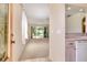 Bright and airy living room with sliding glass doors leading to the outdoors at 5324 Treasure View Way, Leesburg, FL 34748