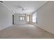 Open-concept living room with a ceiling fan and lots of natural light at 5324 Treasure View Way, Leesburg, FL 34748