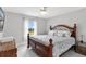 Bright bedroom features a queen bed and a window providing natural light at 5400 Saddleback Ct, Lady Lake, FL 32159