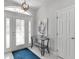 Bright and airy home entrance featuring tile flooring and a glass front door at 5400 Saddleback Ct, Lady Lake, FL 32159