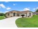 Charming home with a well-manicured lawn, and appealing landscaping at 5400 Saddleback Ct, Lady Lake, FL 32159