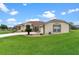 Charming home with a well-manicured lawn, and appealing landscaping at 5400 Saddleback Ct, Lady Lake, FL 32159