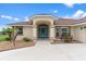 Inviting home exterior featuring a beautifully designed entrance with well maintained landscaping at 5400 Saddleback Ct, Lady Lake, FL 32159